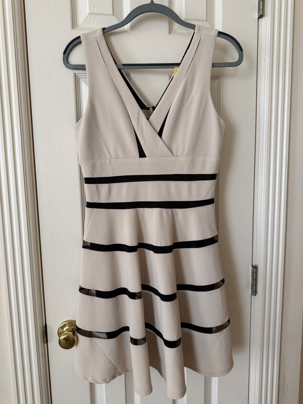 Sleeveless Cream Fit-and-Flare Dress with Black Stripes